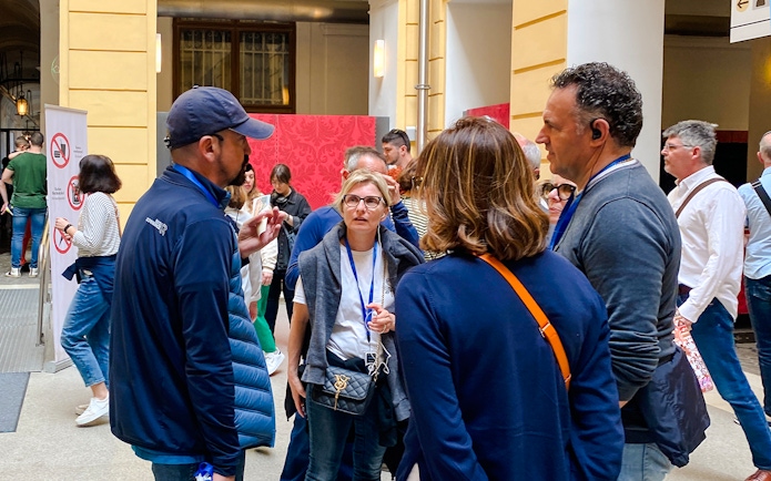 Group of tourists on a guided tour at Schönbrunn Palace, Vienna.