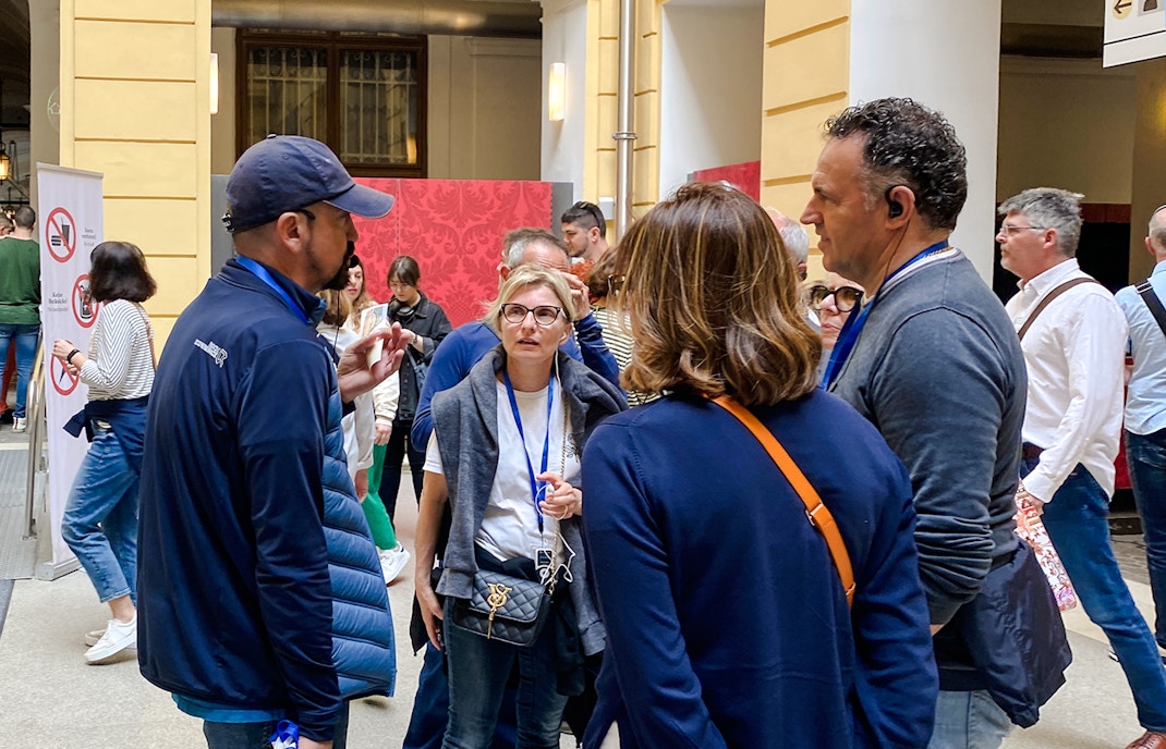 Group of tourists on a guided tour at Schönbrunn Palace, Vienna.