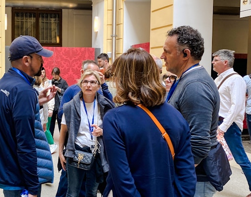 Group of tourists on a guided tour at Schönbrunn Palace, Vienna.