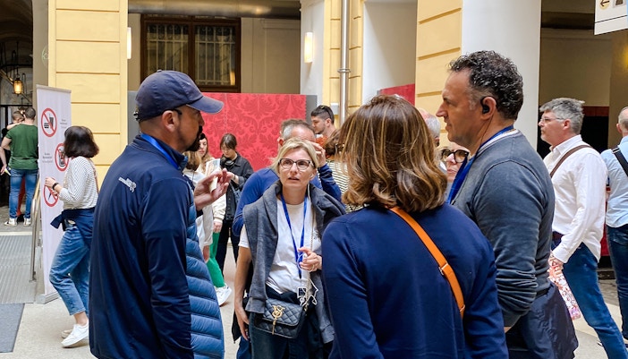 Group of tourists on a guided tour at Schönbrunn Palace, Vienna.