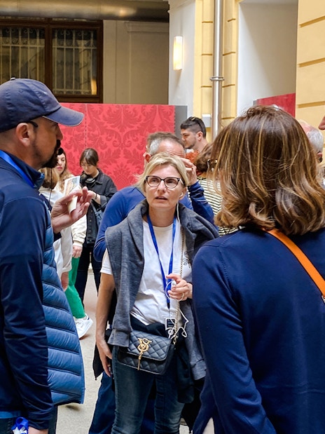 Group of tourists on a guided tour at Schönbrunn Palace, Vienna.