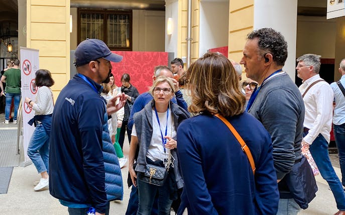 Group of tourists on a guided tour at Schönbrunn Palace, Vienna.