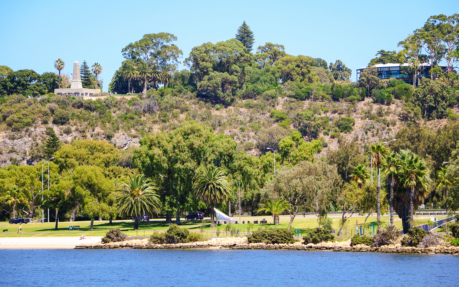 Kings Park landscape with lush greenery and war memorial in Perth, Australia.