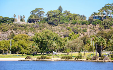 Kings Park landscape with lush greenery and war memorial in Perth, Australia.