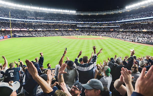 Fans cheering at Yankee Stadium during New York Yankees vs Boston Red Sox game, June 10, 2023.