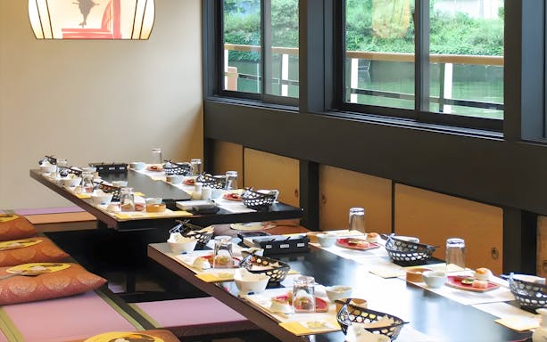 Dining setup on a Yakatabune boat for a traditional Japanese dinner cruise on Tokyo Bay.