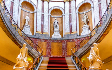 Grand staircase with statues at Bode Museum, Berlin.