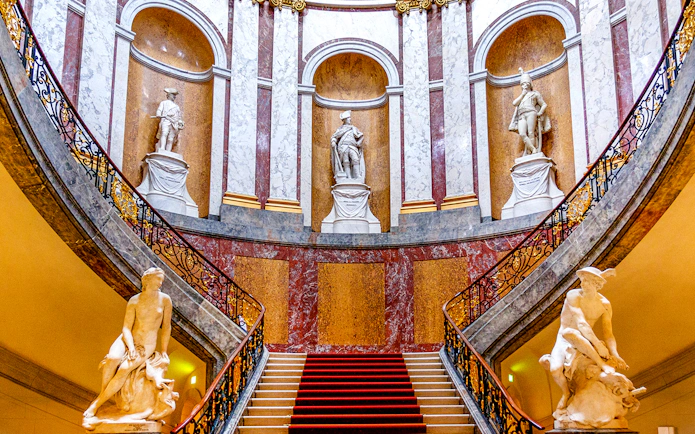 Grand staircase with statues at Bode Museum, Berlin.