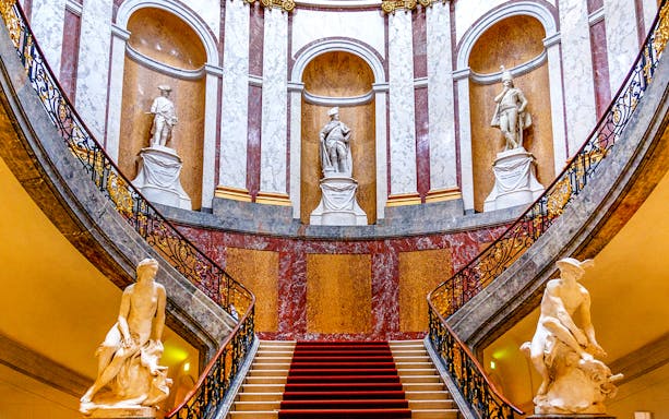 Grand staircase with statues at Bode Museum, Berlin.