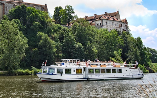 Sightseeing cruise boat on Vistula River near Tyniec Abbey, Krakow.