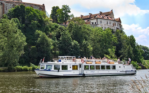 Sightseeing cruise boat on Vistula River near Tyniec Abbey, Krakow.