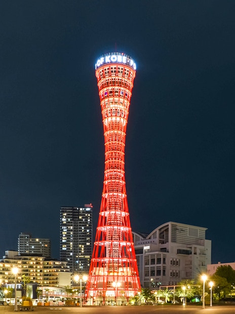 Kobe Port Tower illuminated at night in Kobe, Japan.