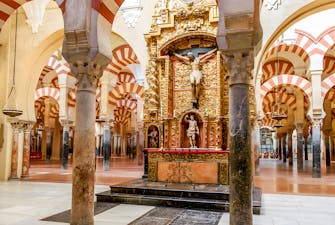 Jesus altar inside Cordoba Cathedral and Mosque with intricate architectural details.