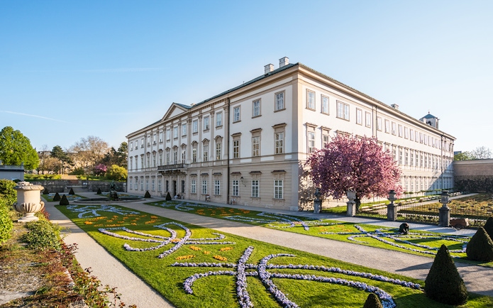 Mirabell Palace gardens with blooming flowers, Salzburg, Austria.