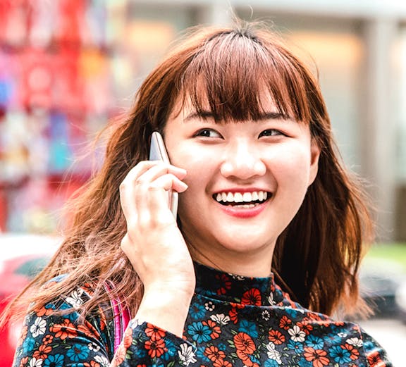 Person using a smartphone in Singapore.
