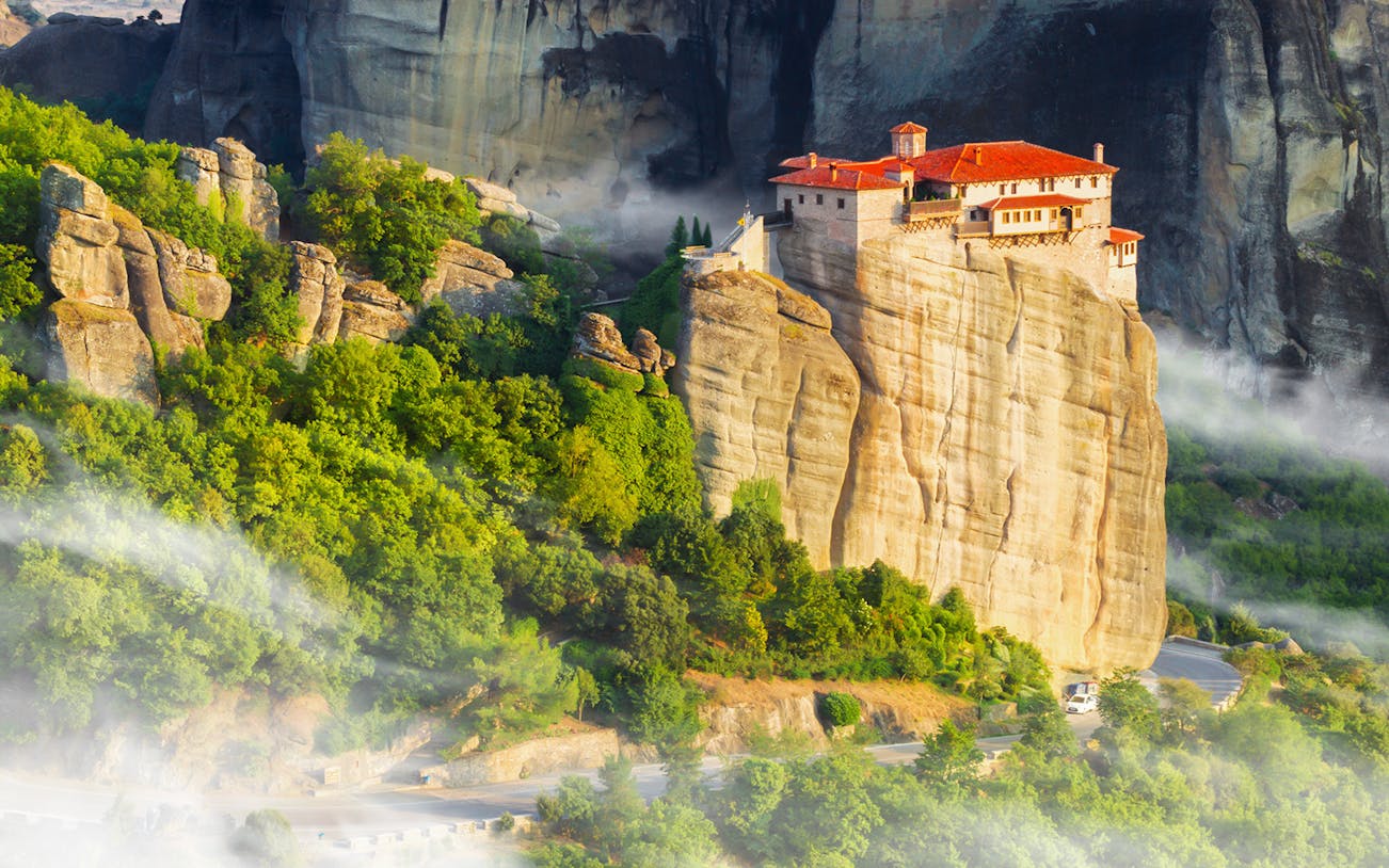 Meteora Monastery perched on rock formations in Greece, showcasing ancient architecture.