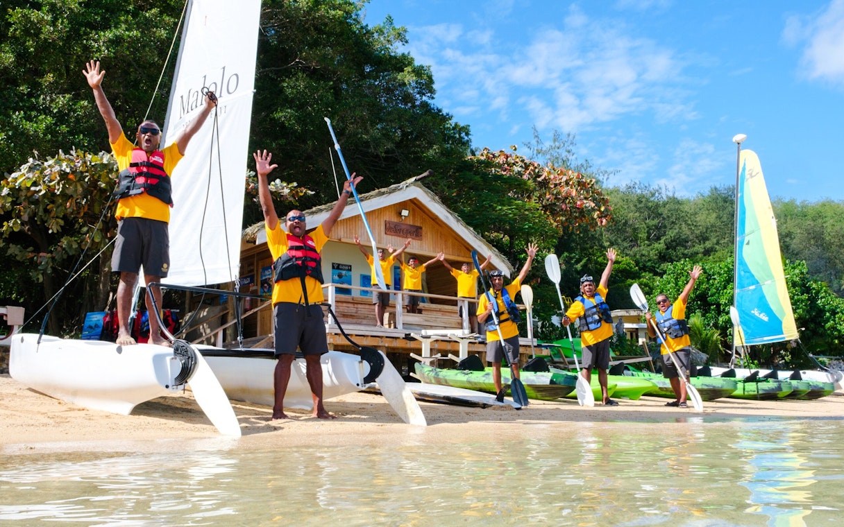 Paddle surfers preparing at Malolo Island Resort, Fiji.