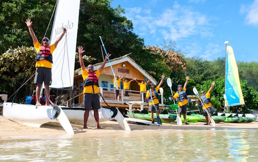 Paddle surfers preparing at Malolo Island Resort, Fiji.