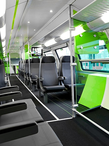 Interior of Vienna City Airport Train with modern seating and large windows.