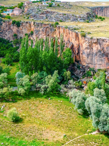 Ihlara Valley's lush greenery and steep cliffs in Cappadocia, Turkey.