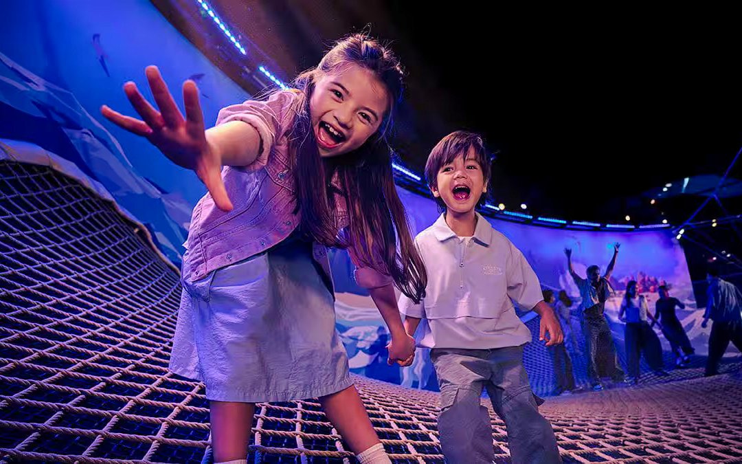 Children playing on a net at SG Oceanarium, Singapore.