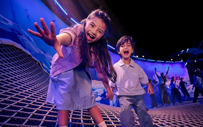 Children playing on a net at SG Oceanarium, Singapore.