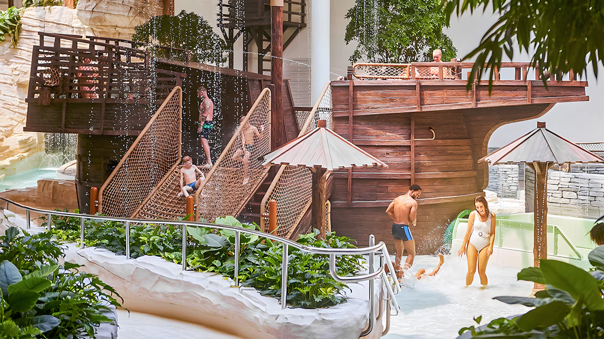 Bellewaerde Aquapark visitors enjoying water play area with wooden ship structure in Ypres.