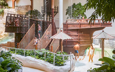 Bellewaerde Aquapark visitors enjoying water play area with wooden ship structure in Ypres.