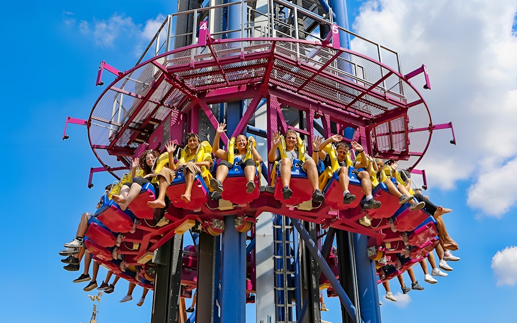 Thrill-seekers on a drop tower ride at MagicLand Amusement Park.