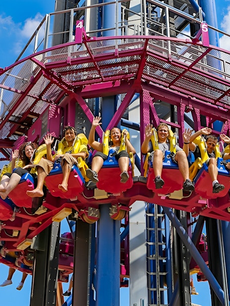 Thrill-seekers on a drop tower ride at MagicLand Amusement Park.