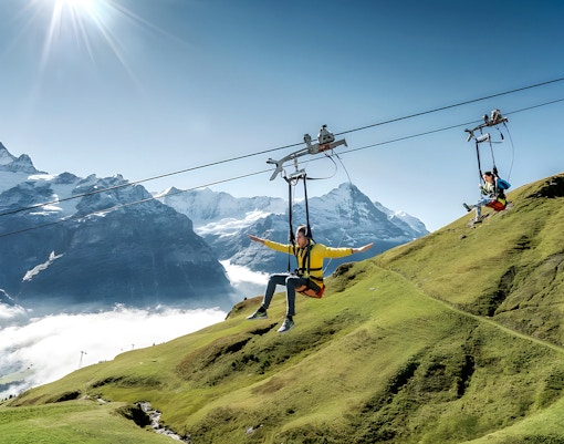 First Flyer ascending to Grindelwald First with panoramic views of Swiss Alps from Lucerne.