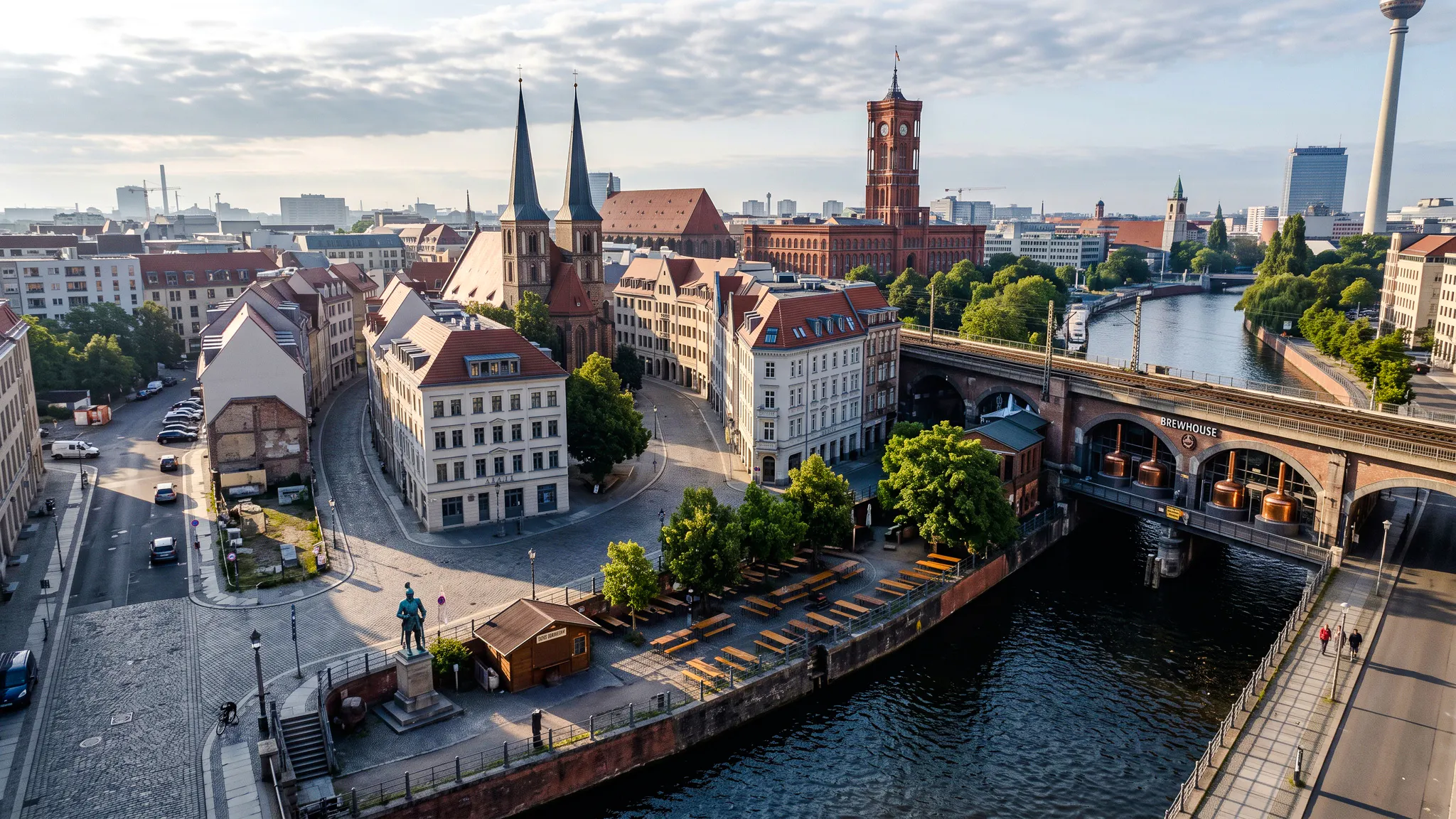 Berlin cityscape with historic buildings and a brewhouse along the river, part of Oktoberfest walking tour.