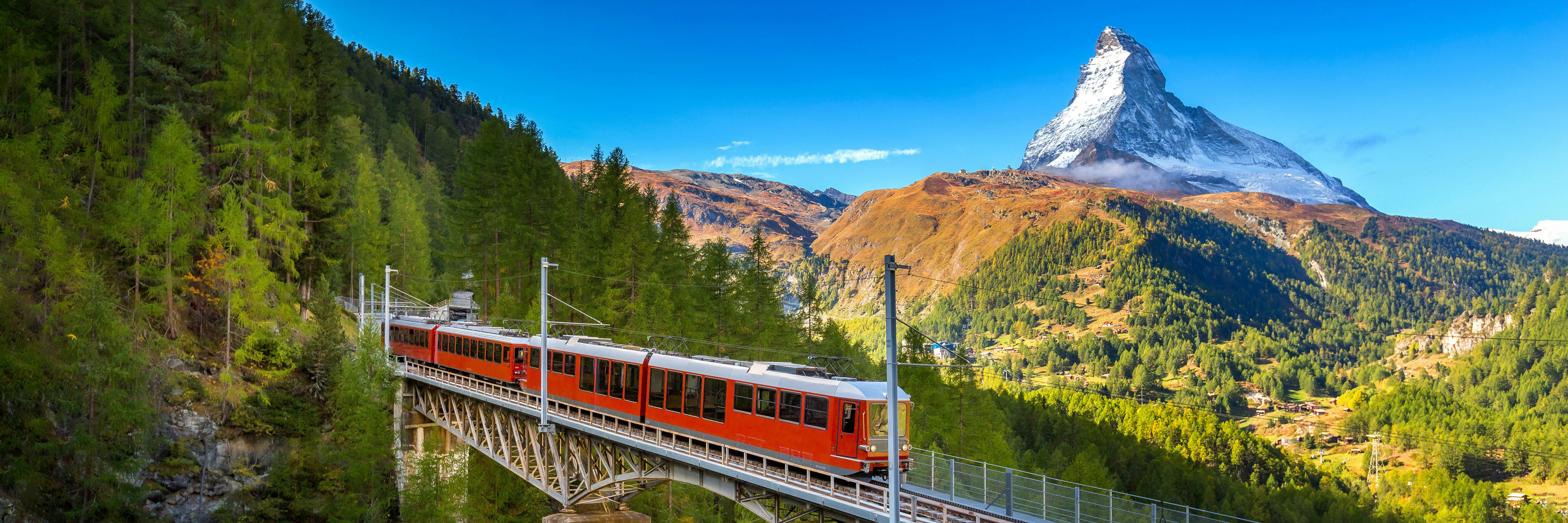 Eurail and Interrail trains crossing scenic European landscapes.