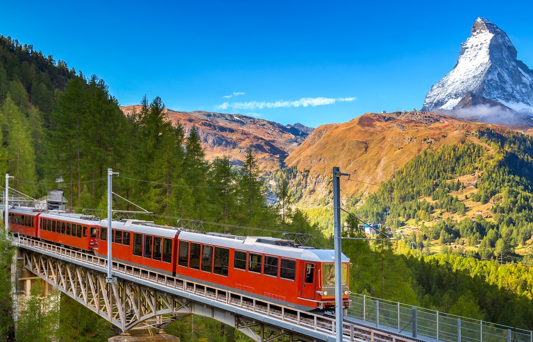 Eurail and Interrail trains crossing scenic European landscapes.