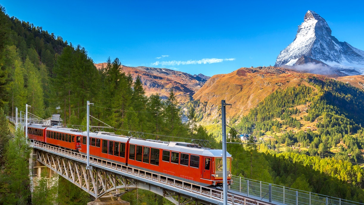 Eurail and Interrail trains crossing scenic European landscapes.