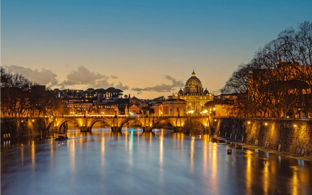 St. Peter's Basilica and Tiber River at dusk, Rome city exploration game.