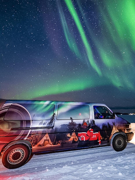 Van used for Lapland Lake Ice Floating transfers under Northern Lights.