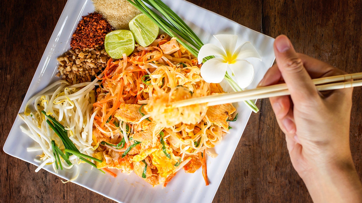Pad Thai with garnishes in Thai cooking class at Mama Noi Organic Garden.