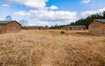 Brick barracks and open field inside Sachsenhausen Camp, Sachsenhausen.
