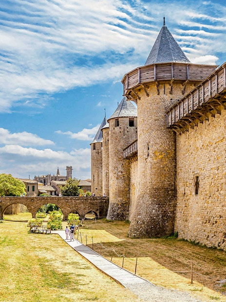 Carcassonne medieval walls and towers on walking tour path with audio guide.