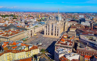Aerial view of Milan Cathedral and surrounding cityscape, part of Milan's Lost Duke exploration game.