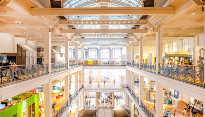 Visitors engage with various interactive displays at the Science Museum in London