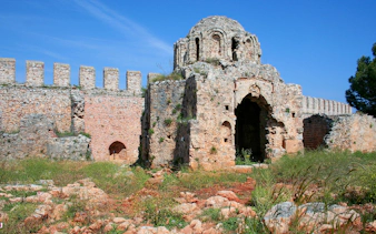 Ancient stone ruins at Alanya Castle, Turkey, with a clear blue sky.