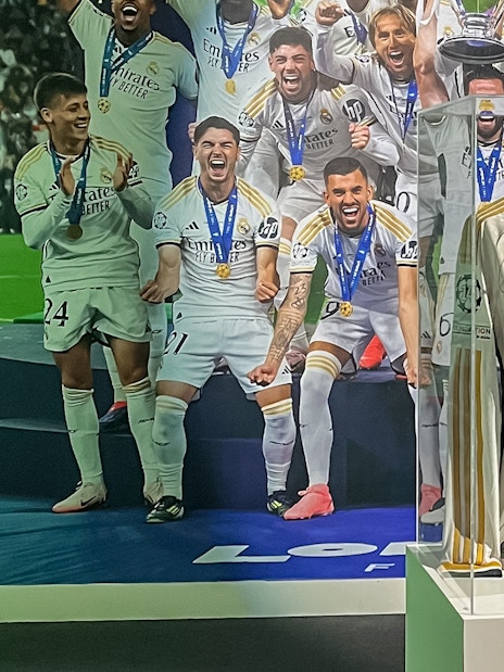 Signed Real Madrid jersey on display at Santiago Bernabeu Stadium exhibit.