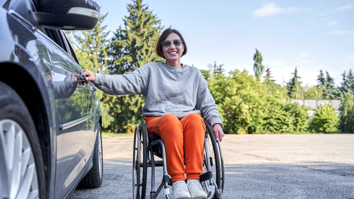 Woman on wheelchair feeling happy at Alnwick Castle