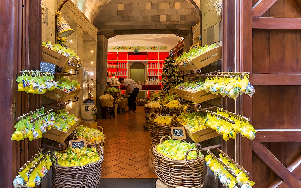 Lemon-themed shop interior in Positano, part of a guided day trip from Rome.