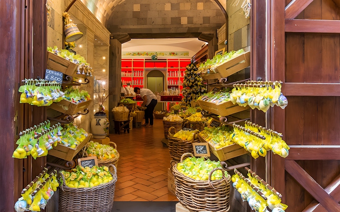 Lemon-themed shop interior in Positano, part of a guided day trip from Rome.