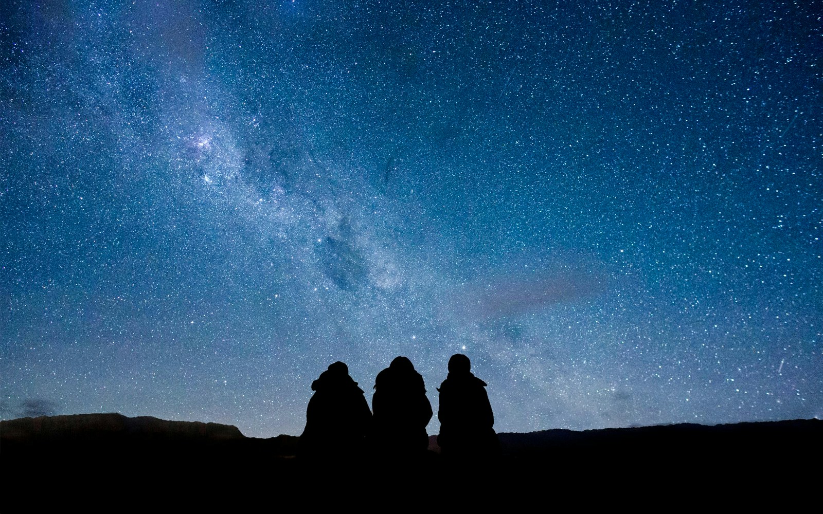 Stargazing at Mt. John Observatory under a star-filled sky.