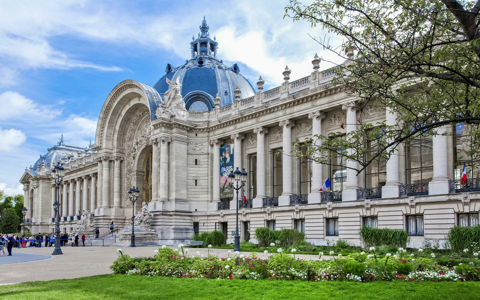 Petit Palais exterior with ornate columns and dome in Paris, France.