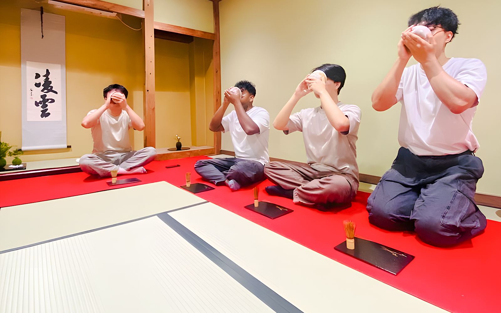 Men participating in a matcha tea ceremony in Osaka, Japan.